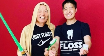 Dentists wearing Star Wars themed flossing shirts