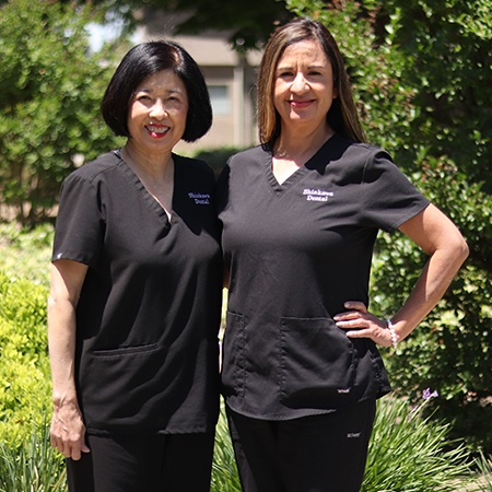 Dentist pointing to smile model