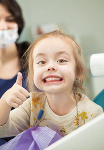 Child smiling at the dentist