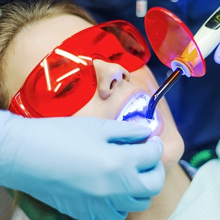 Patient receiving dental bonding treatment