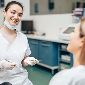 dentist talking to patient about cosmetic dentistry in Fresno