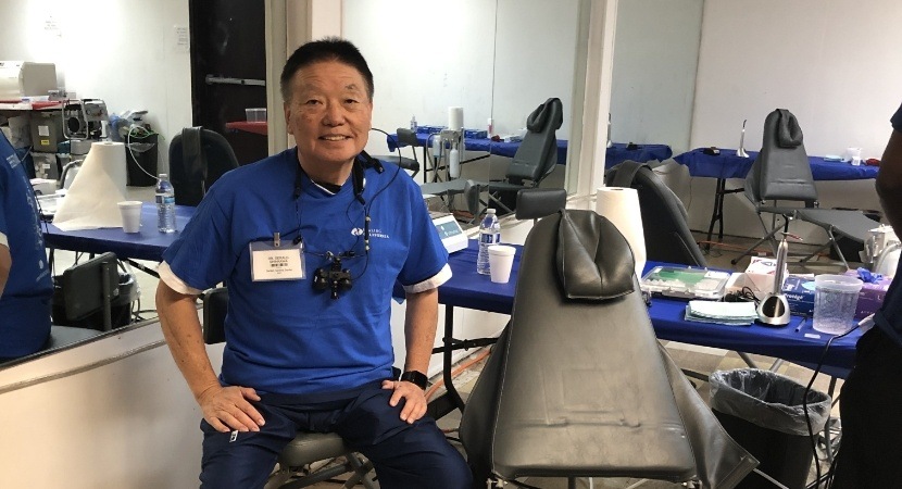 Dentist sitting in dental treatment room