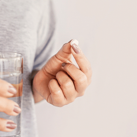 Woman taking pill