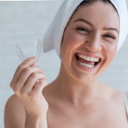 Woman holding a mouthguard in Fresno