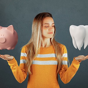 A woman considering the cost of dental implants in Fresno
