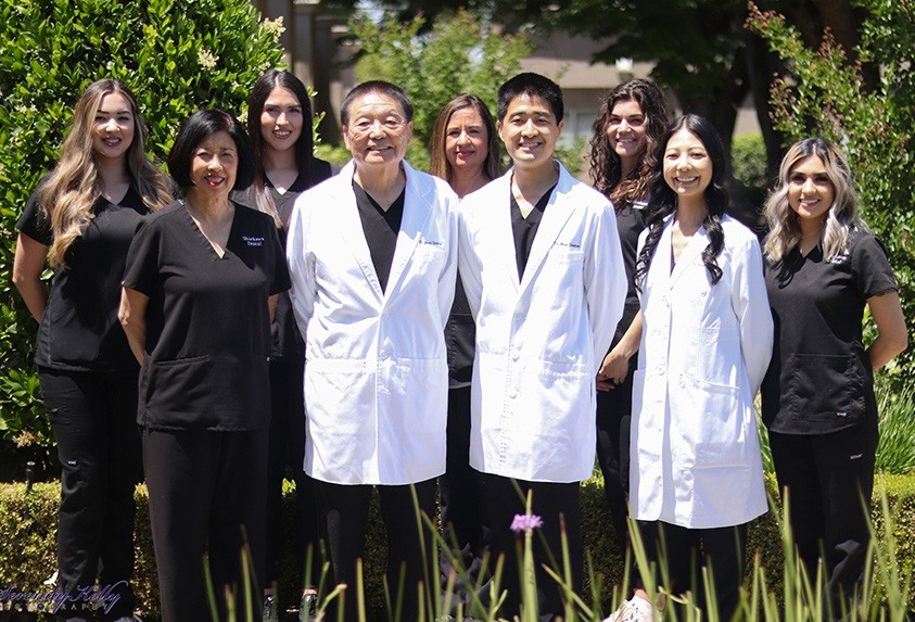 The Shinkawa Dental team standing outside in Fresno