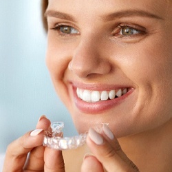 Smiling woman with Invisalign in Fresno