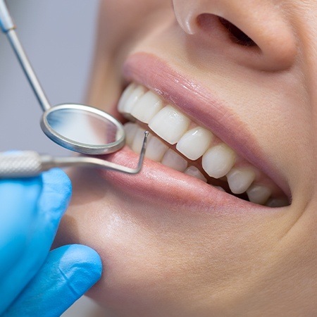 Patient receiving scaling and root planing periodontal therapy