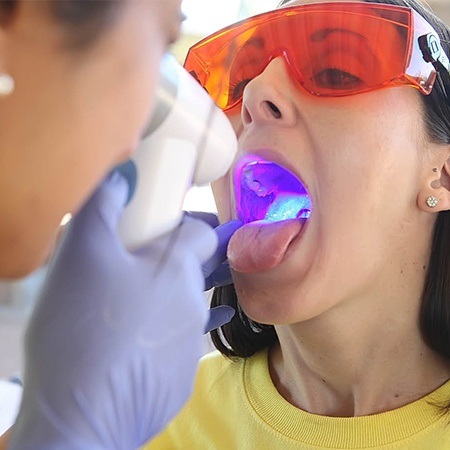 Patient receiving oral cancer screening