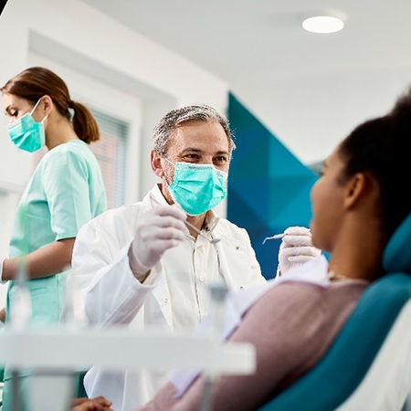 Dentist smiling at patient prior to root canal therapy