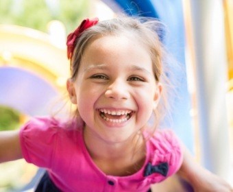 Little girl with healthy smile after children's dentistry