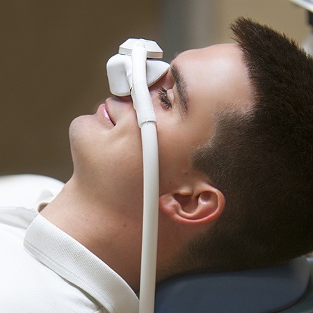Patient with nitrous oxide dental sedation mask
