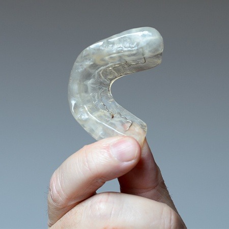 Hand holding occlusal splints