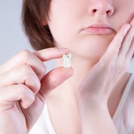 Person holding their wisdom tooth