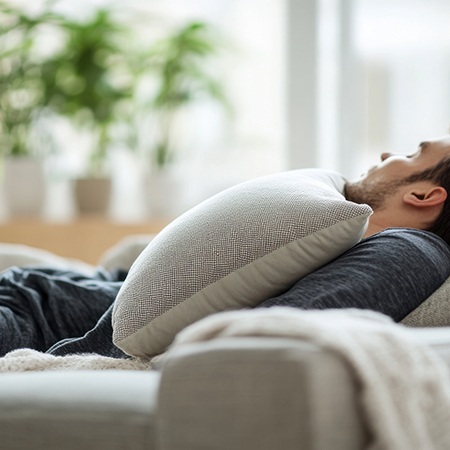 Man asleep at home with head elevated