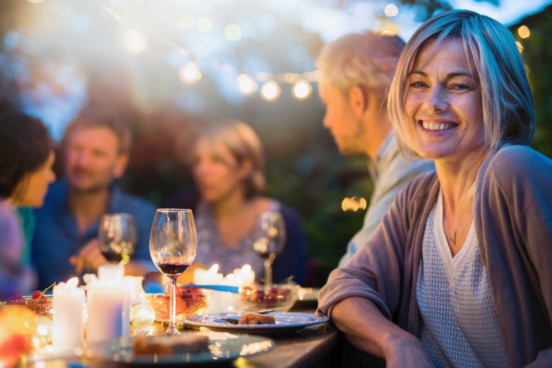 Woman smiling with dental implant