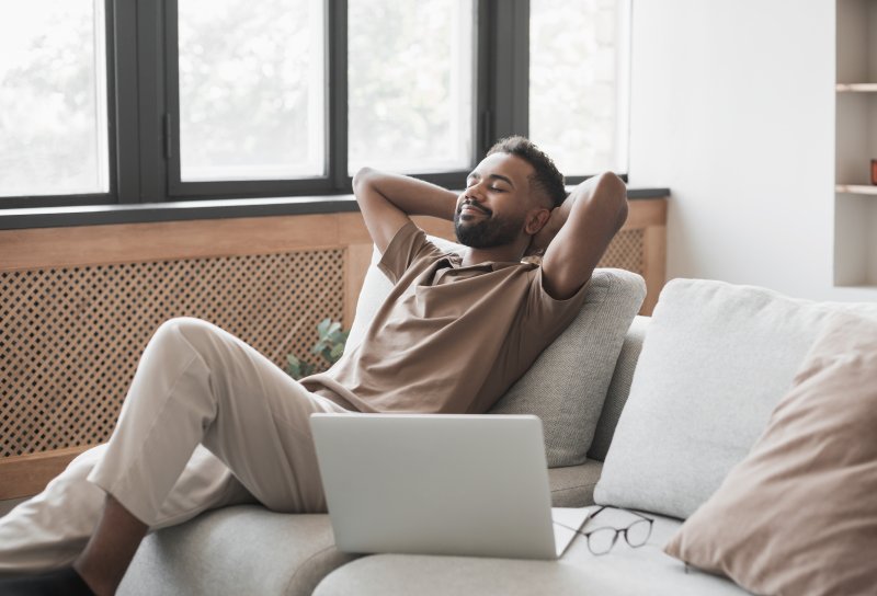 Patient resting at home after tooth extraction